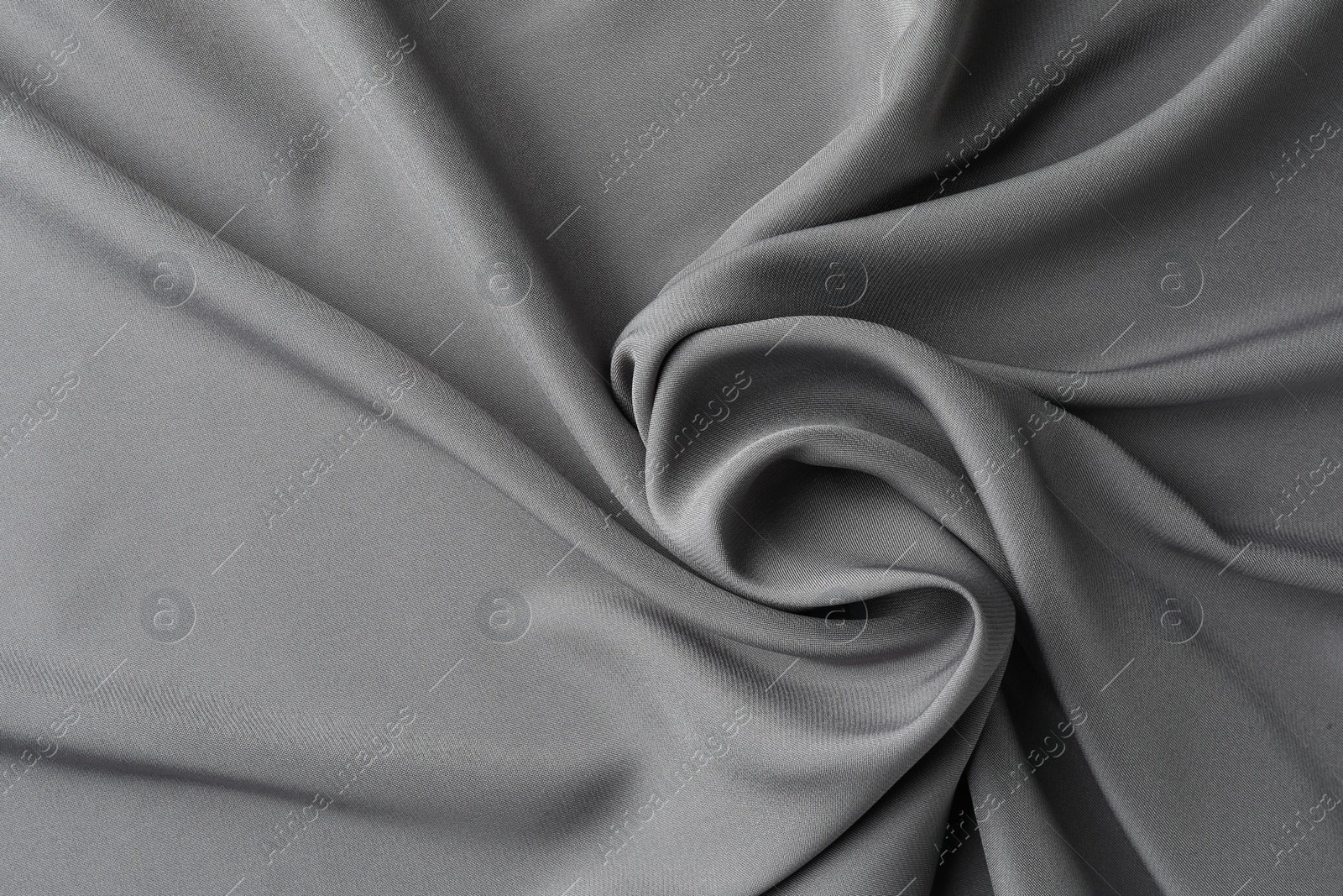 Photo of Texture of grey crumpled silk fabric as background, top view