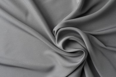 Texture of grey crumpled silk fabric as background, top view