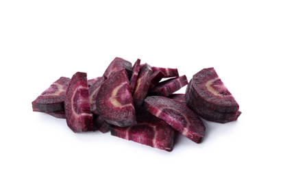 Photo of Slices of raw purple carrot isolated on white