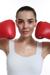 Photo of Beautiful woman in boxing gloves on white background