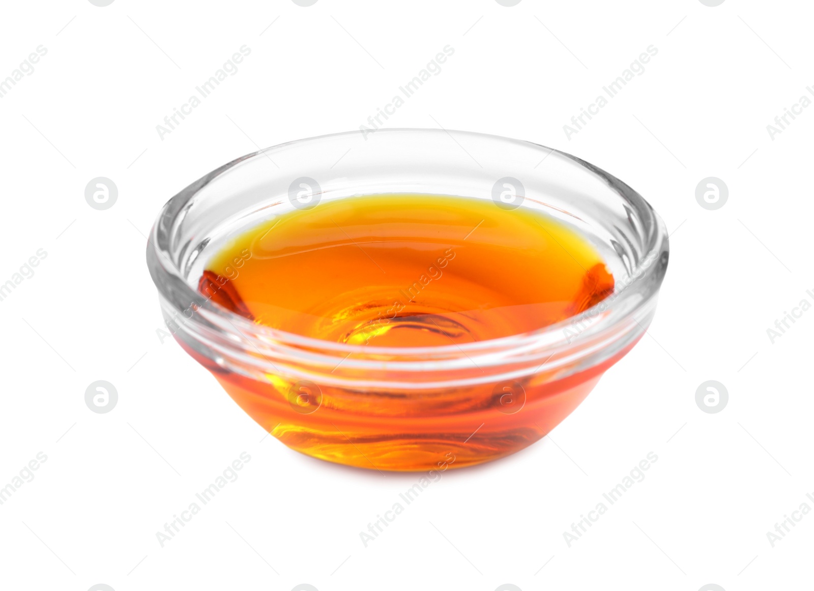 Photo of Glass bowl with orange food coloring isolated on white