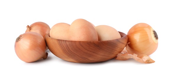 Photo of Easter eggs painted with natural dye and onions on white background