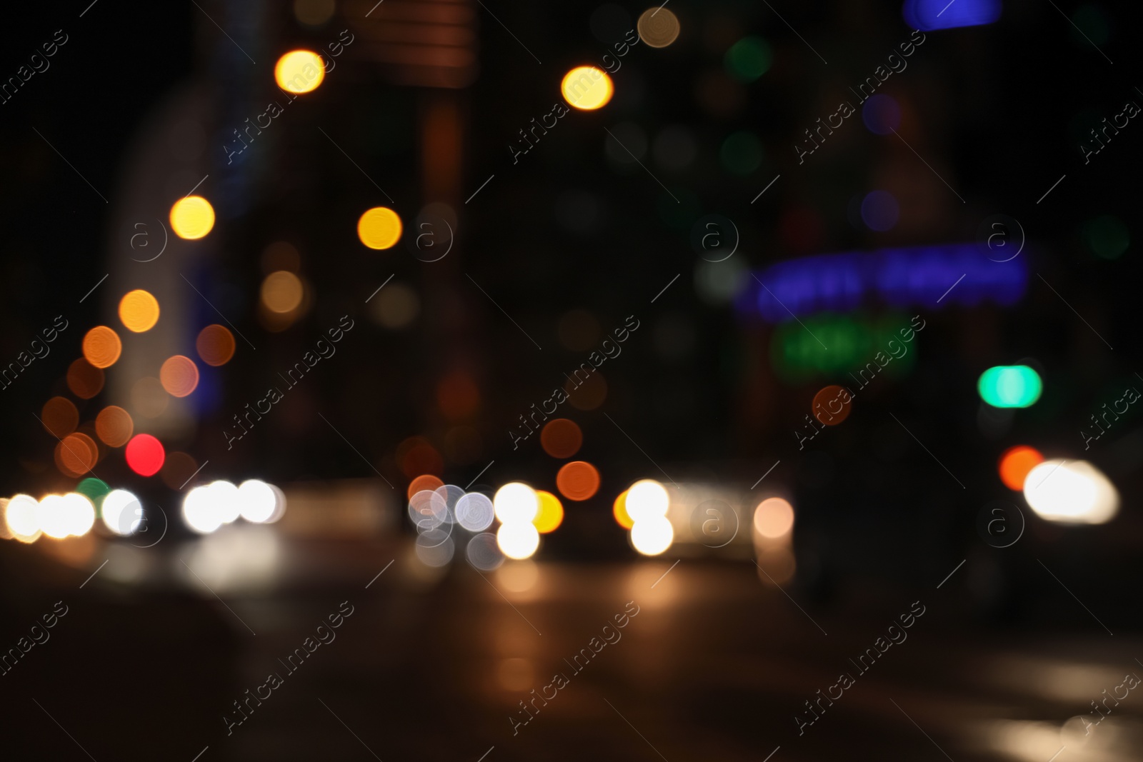 Photo of Blurred view of cityscape with bokeh effect. Night life