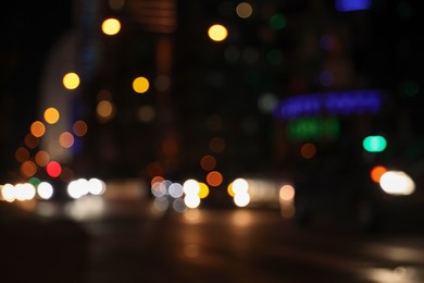 Photo of Blurred view of cityscape with bokeh effect. Night life