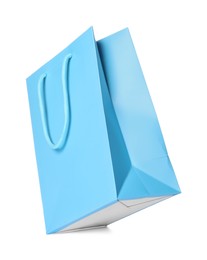 Photo of One light blue shopping bag isolated on white