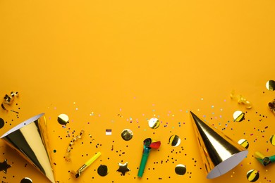 Photo of Flat lay composition with party items on orange background, space for text