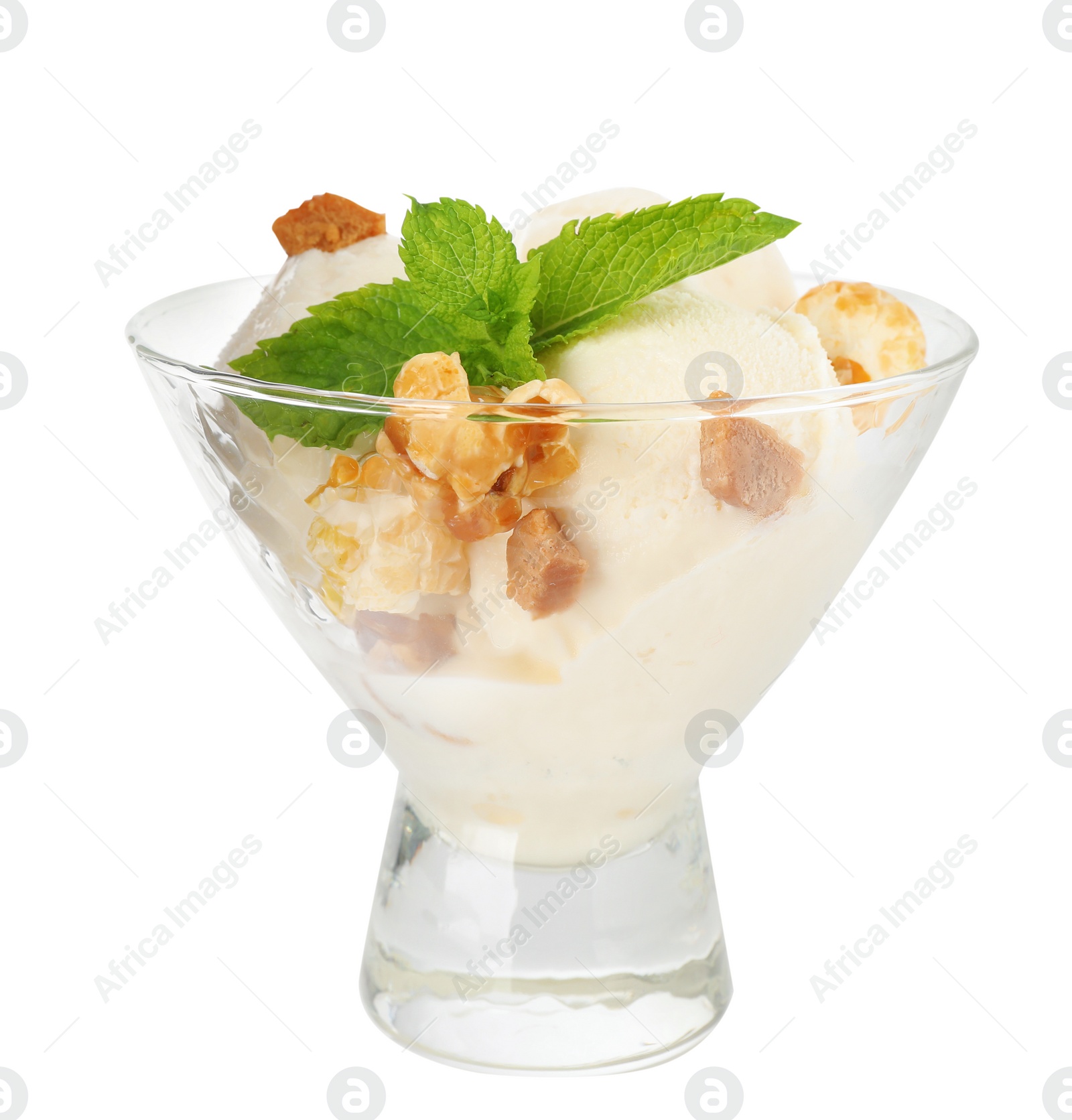 Photo of Delicious ice cream with caramel candies and  popcorn in dessert bowl on white background
