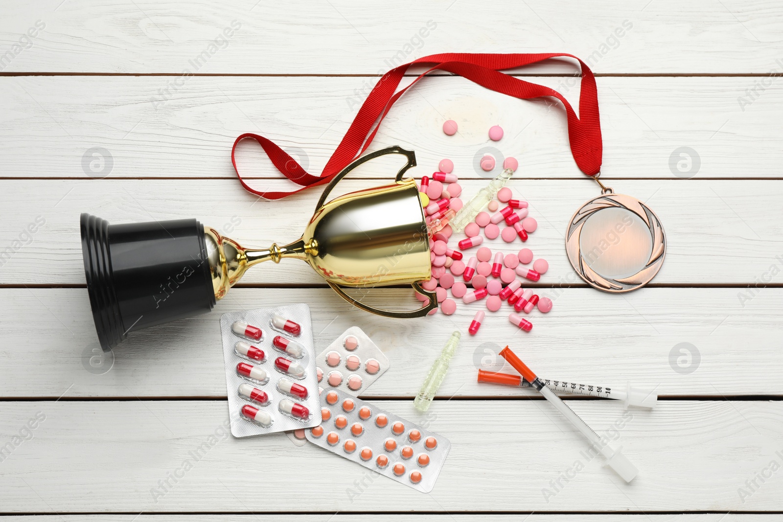 Photo of Flat lay composition with drugs on white wooden table. Doping control