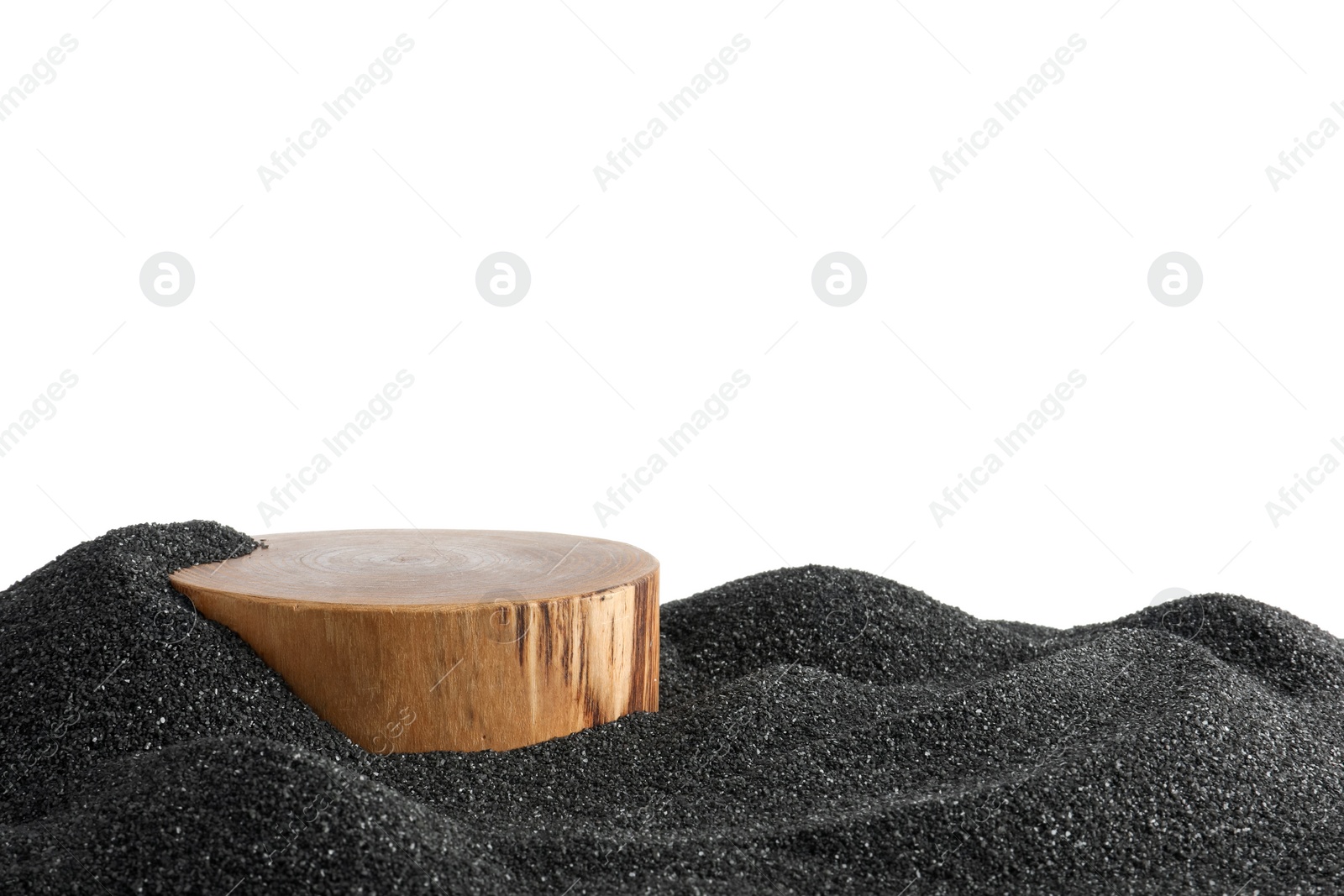 Photo of Presentation of product. Wooden podium on black sand against white background