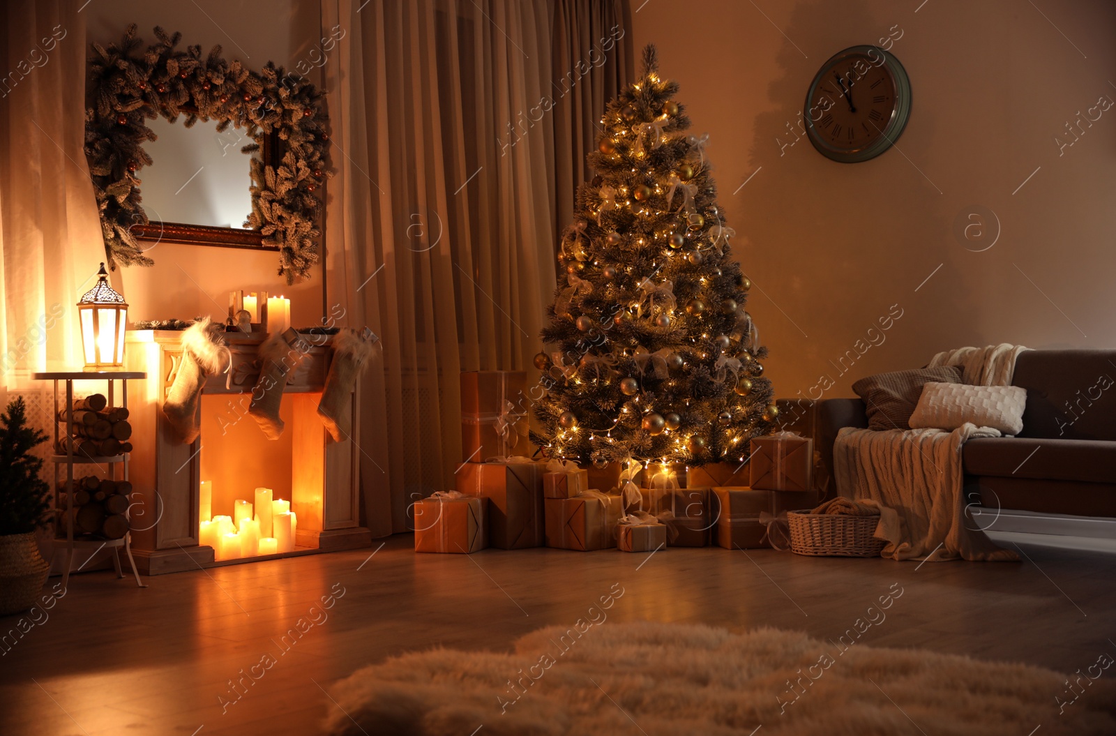 Photo of Stylish interior with decorative fireplace and beautiful Christmas tree in evening