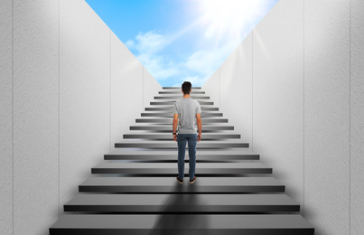 Image of Man standing on stairs and looking forward. Way to success