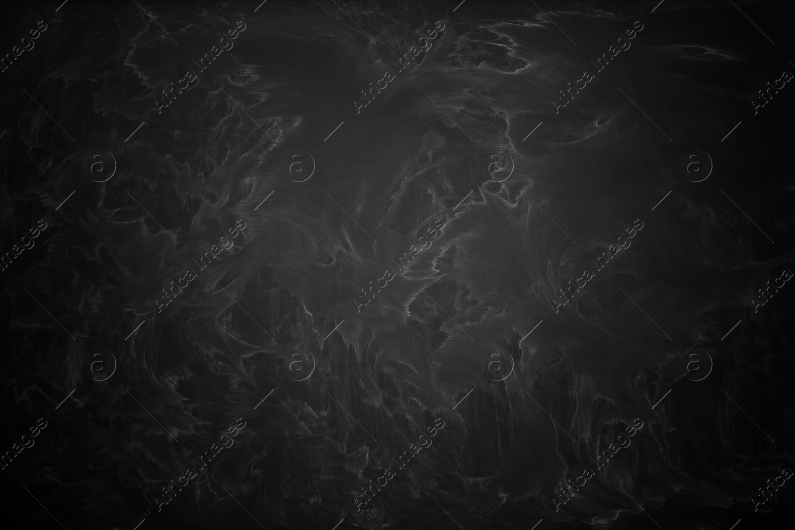 Image of Dirty black chalkboard as background. Vignette effect