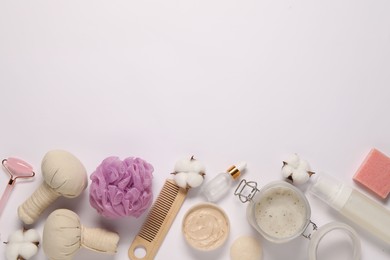 Bath accessories. Flat lay composition with personal care products on white background, space for text