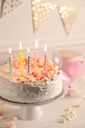 Photo of Tasty Birthday cake with burning candles on white table, closeup