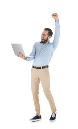 Photo of Emotional young man with laptop celebrating victory on white background