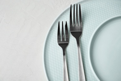 Beautiful table setting on grey background, top view. Space for text