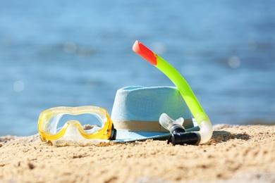 Photo of Composition with beach objects on sand against blurred background