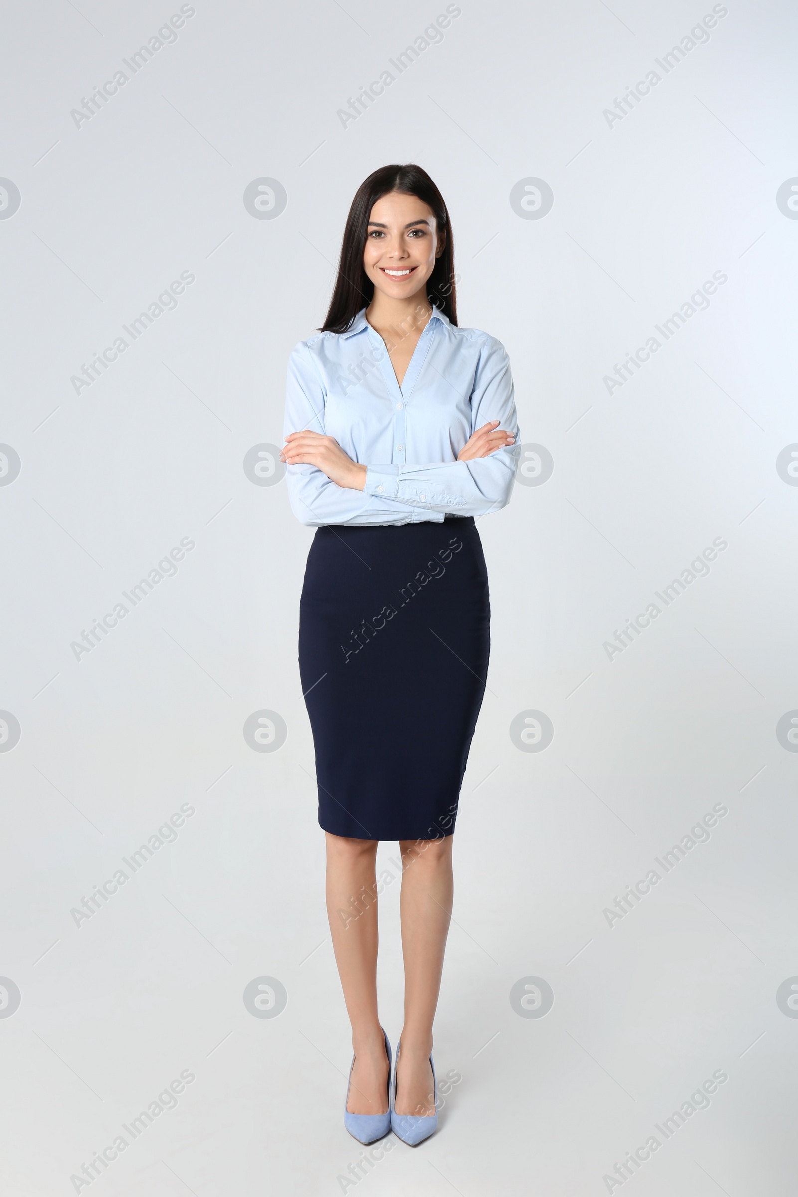 Photo of Full length portrait of young businesswoman on white background