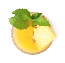 Photo of Glass of tasty pineapple cocktail with mint isolated on white, top view