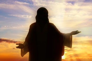 Image of Silhouette of Jesus Christ outdoors at sunset