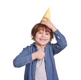 Photo of Birthday celebration. Cute little boy in party hat showing thumbs up on white background