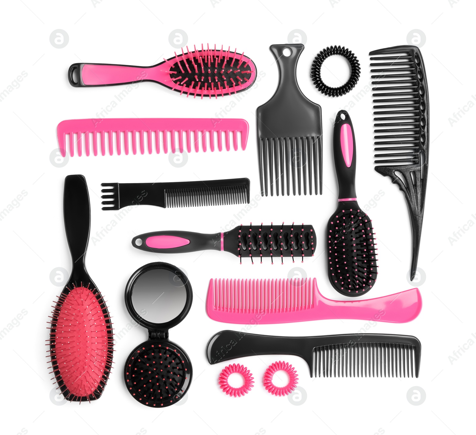 Photo of Set of modern hair combs and brushes and spiral rubber bands isolated on white, top view