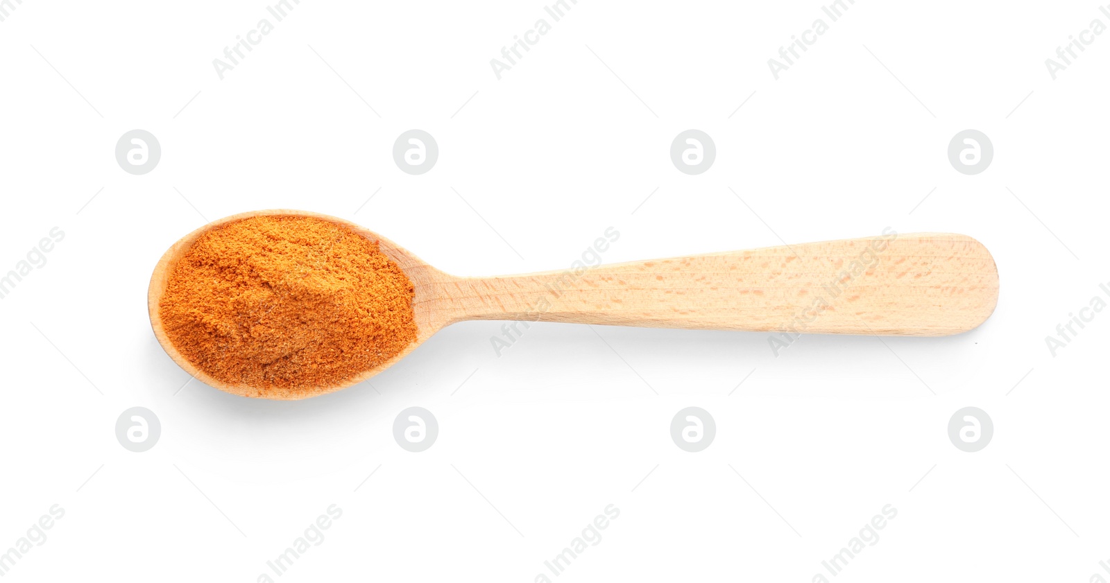 Photo of Wooden spoon with red pepper powder on white background, top view