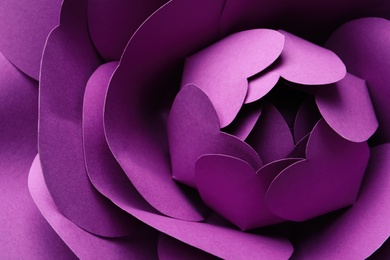 Photo of Beautiful purple flower made of paper as background, top view