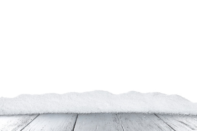 Heap of snow on grey wooden surface against white background