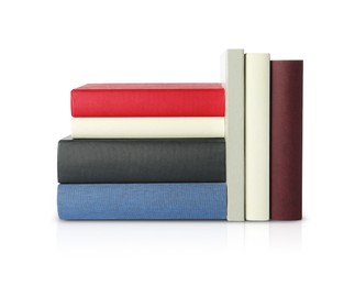 Photo of Many different hardcover books on white background