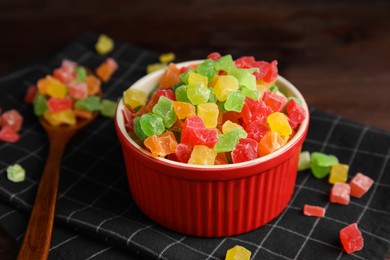 Photo of Mix of delicious candied fruits in bowl on table, closeup