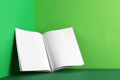 Photo of Empty book pages on color background. Mockup for design