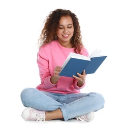 Beautiful African-American woman reading book on white background