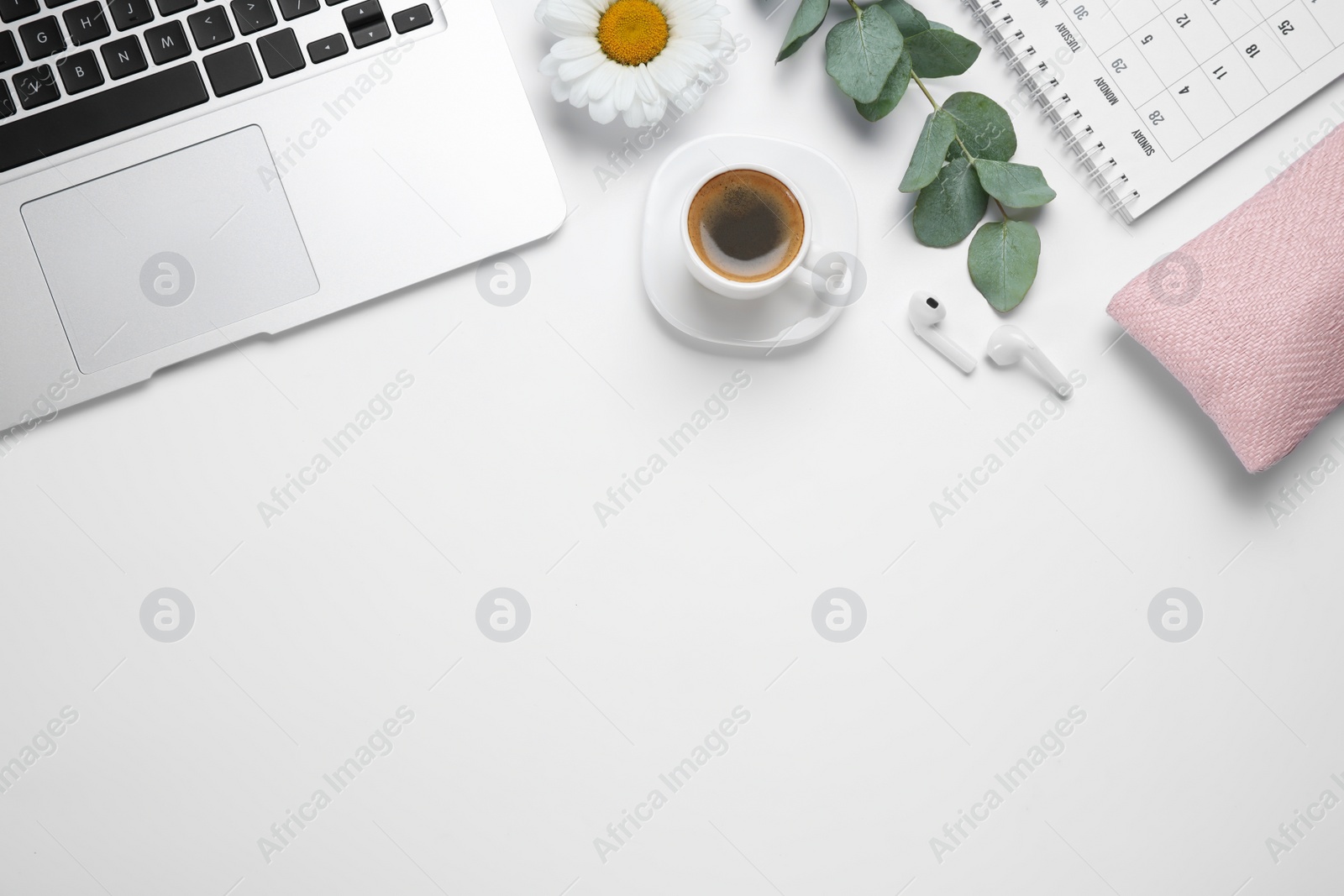 Photo of Composition with cup of coffee and laptop on white background, top view