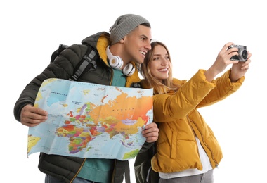 Couple with map and camera on white background. Winter travel