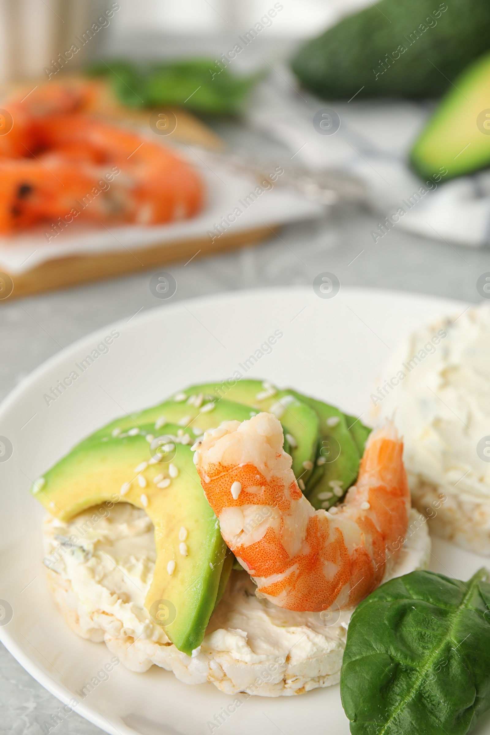 Photo of Puffed rice cake with shrimp and avocado served on table