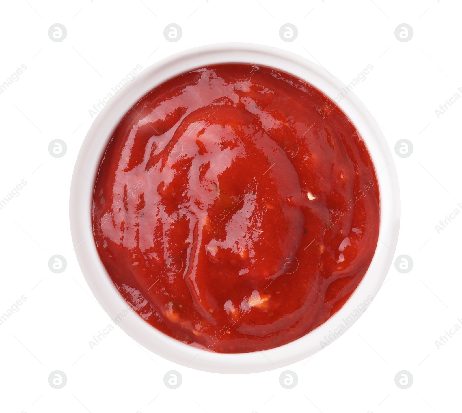 Photo of Bowl with red sauce isolated on white, top view