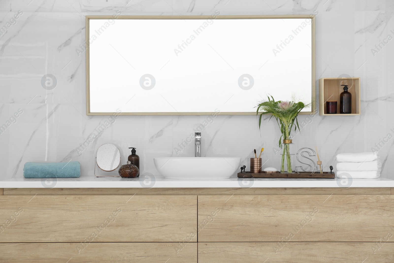 Photo of Modern bathroom interior with stylish mirror and vessel sink