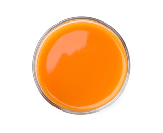 Photo of Tasty fresh carrot juice in glass isolated on white, top view