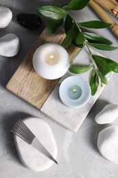 Flat lay composition with acupuncture needles on light grey marble table