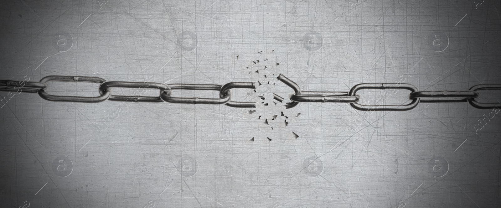 Image of Broken metal chain on grey background. Freedom concept 