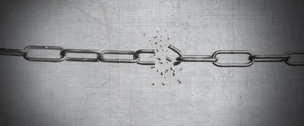 Image of Broken metal chain on grey background. Freedom concept 