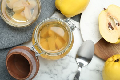 Photo of Delicious quince drink and fresh fruits on white marble table, flat lay