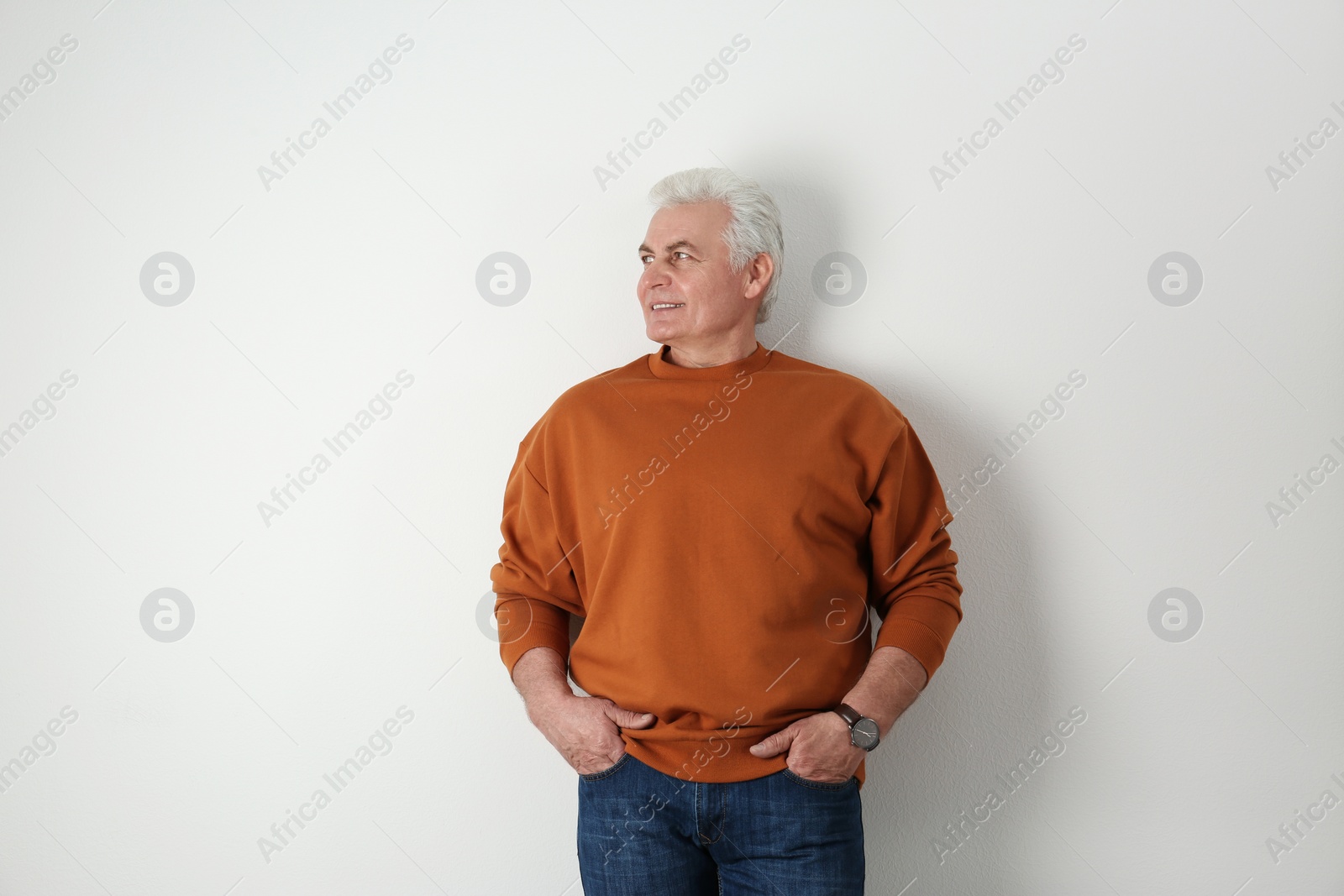 Photo of Portrait of handsome mature man on light background