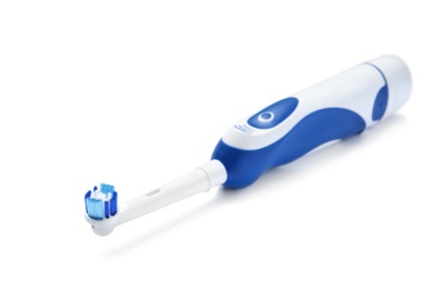 Photo of Electric toothbrush on white background. Dental care