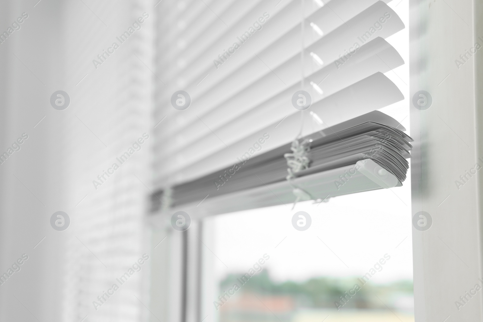 Photo of Closeup view of stylish horizontal window blinds