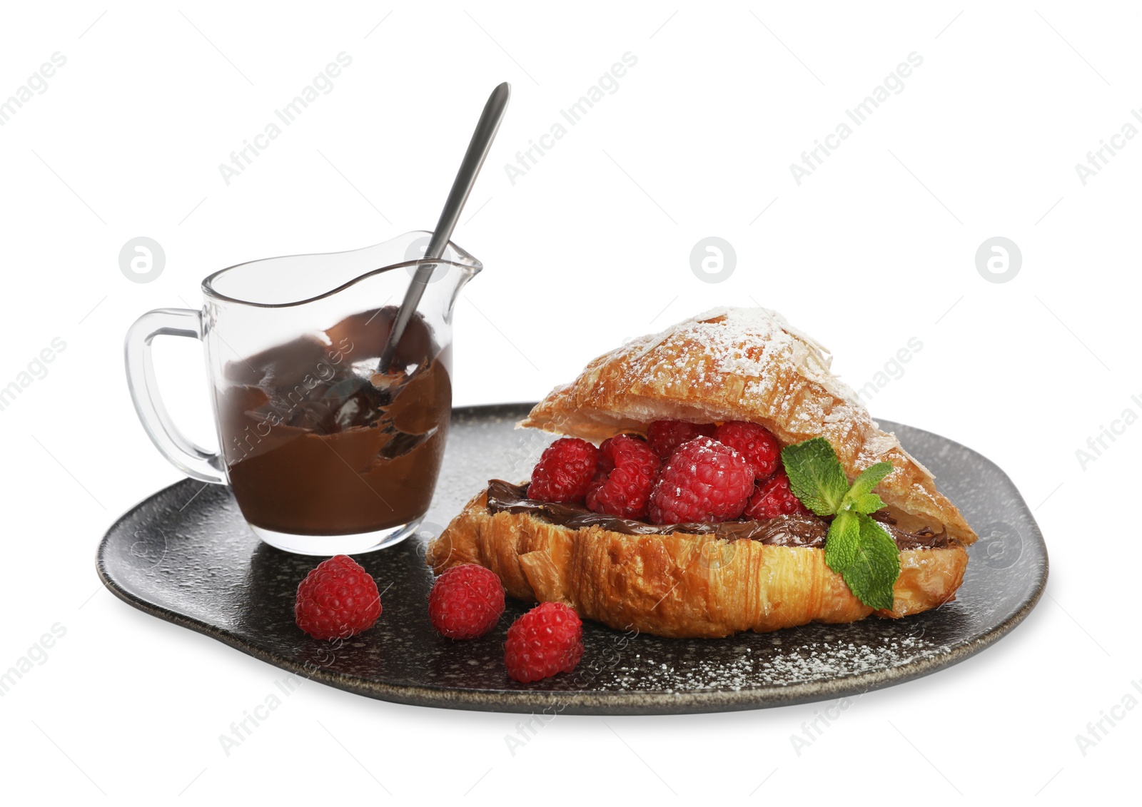 Photo of Delicious croissant with raspberries, chocolate and powdered sugar isolated on white