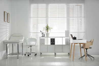 Photo of Doctor's office interior with modern workplace in clinic