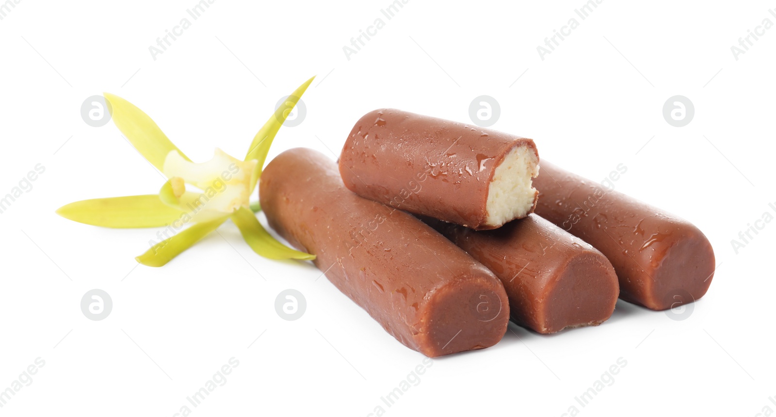 Photo of Glazed curd cheese bars and vanilla flower isolated on white