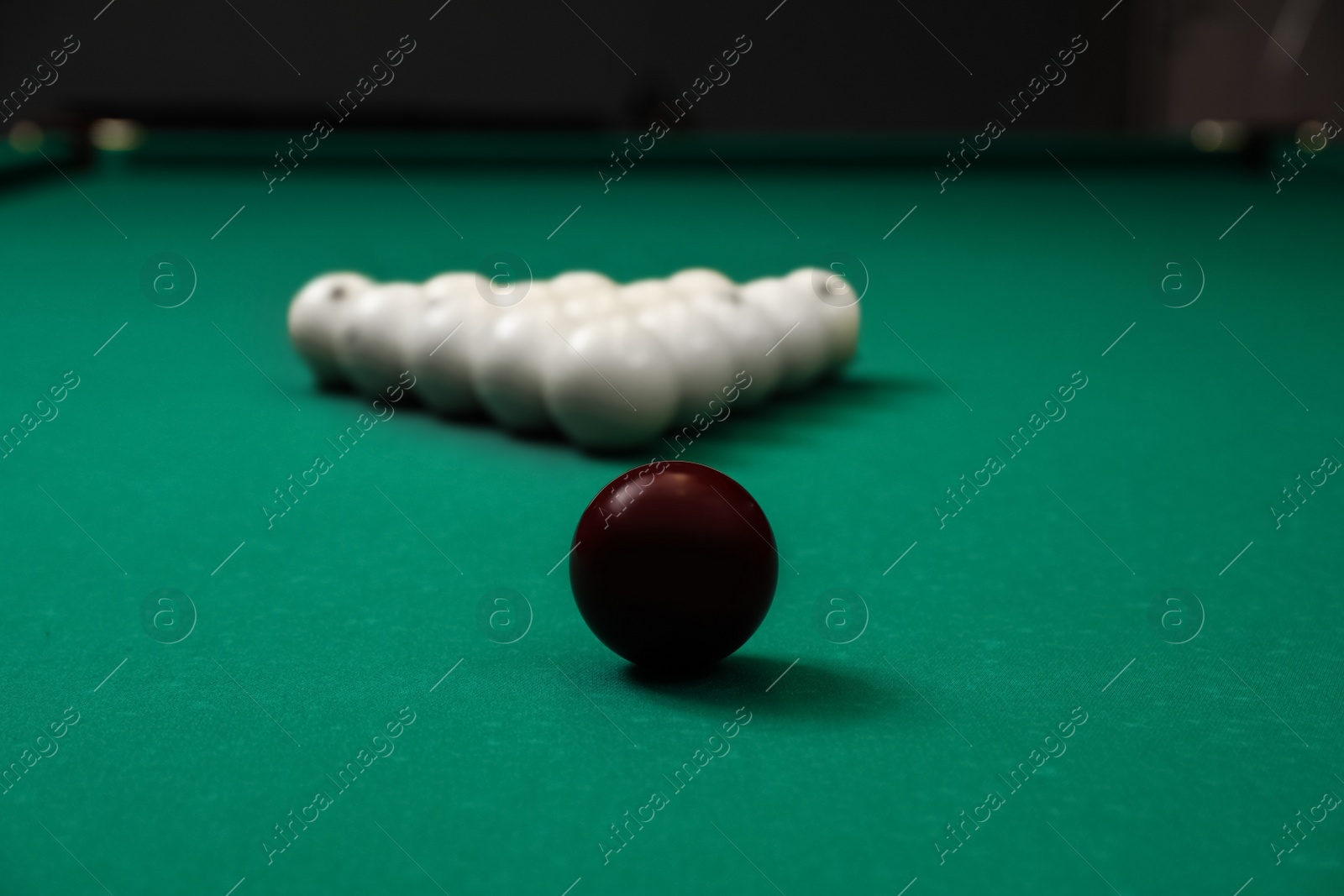 Photo of Different balls on modern billiard table indoors